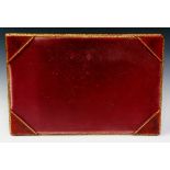 A red Morocco leather and tooled gilt writing desk blotter, 31cm high, 47cm wide,