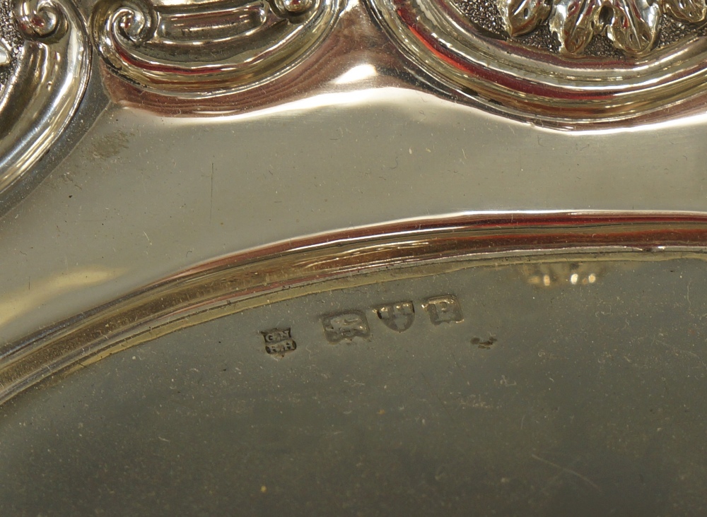 A Victorian shaped oval dish embossed with alternate panels of flower heads and shells, - Image 2 of 2