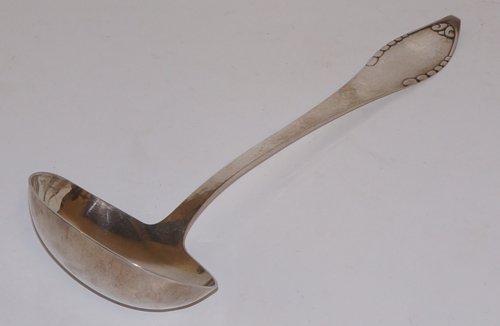 A Danish silver ladle with leaf clasped hammer textured handle and plain bowl, 31. - Image 2 of 2