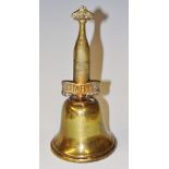 A cast brass Schweppes bell, the handle stamped, "Rings clear and sweet!" 14.5cm high, 6.