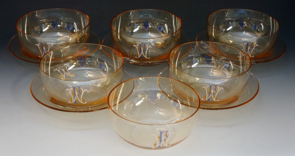 A 19th Century set of six iridescent amber coloured glass finger bowls with five matching stands,