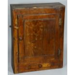 An oak spice cupboard enclosed by a panelled door above short drawer, H-brass hinges,