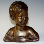 Donatello (after) - a bronze head and shoulder bust of a smiling young boy,