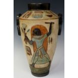 A continental pottery Egyptian revival vase of tapered cylindrical design incised overall with