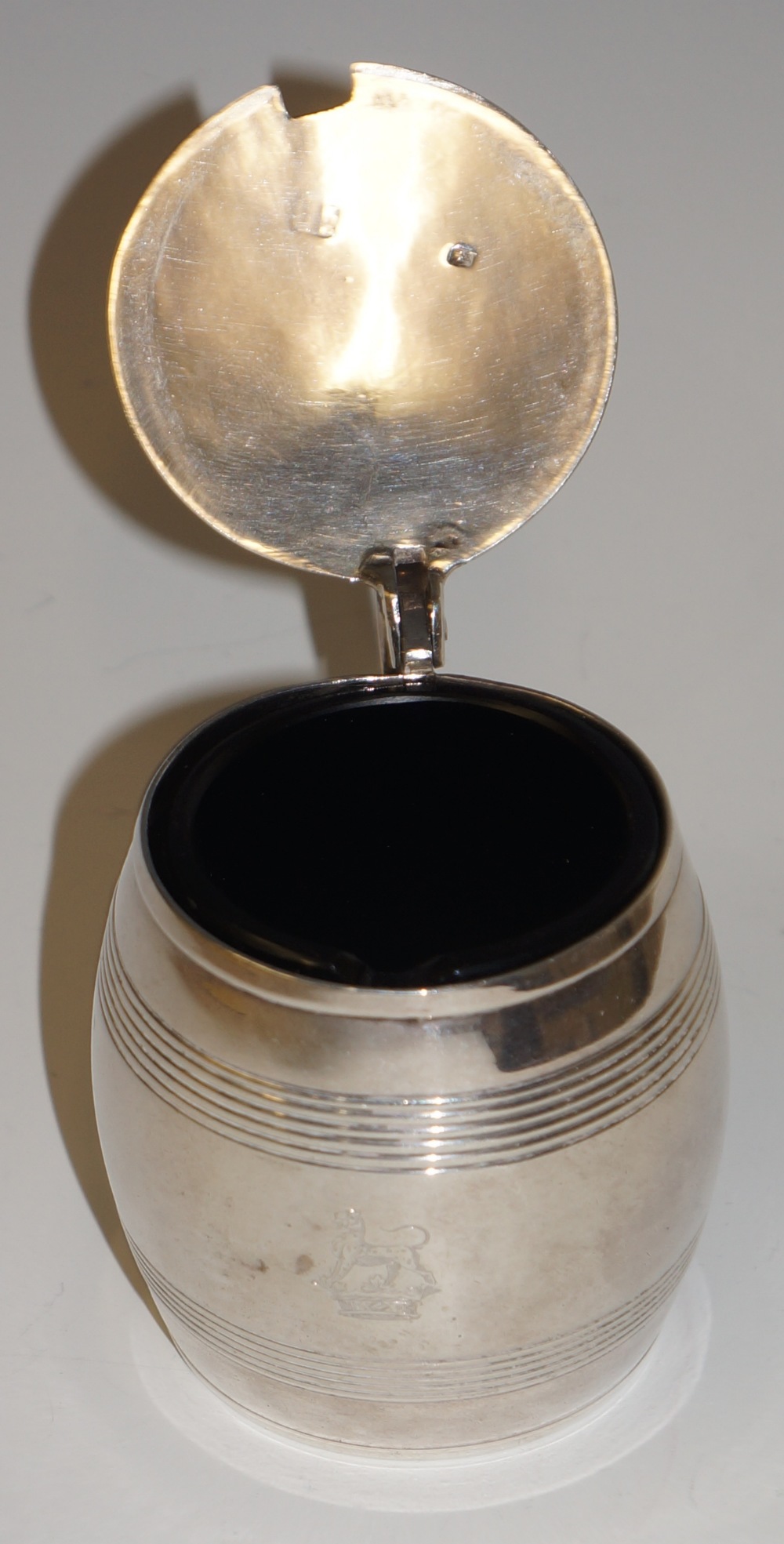 A George III barrel shaped lidded mustard with reeded bands engraved with a crest, scroll handle, - Image 2 of 2