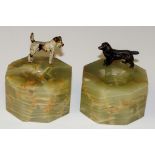 A pair of pin trays each mounted with a cold painted dog on octagonal onyx base, 6.5cm wide, 7.