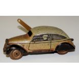 A tin plate clockwork car, the body printed and inscribed "Foreign", 9.