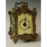 A French carriage clock the silver plated brass case with cast front of ribbon tied swags,