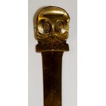 A Victorian brass letter opener with stylized owl handle doubling as spring loaded clip, 29cm long,