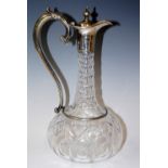 A Victorian pressed glass claret jug, with silver plated collar, spout and scroll handle, 28cm high,