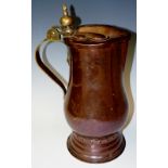 An interesting Arts and Crafts copper lidded flagon with ball and spire thumb piece finial and