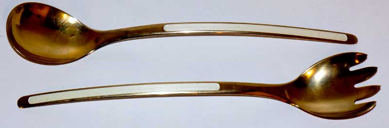 A pair of Norwegian silver gilt and white enamel salad servers of plain design,