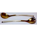 A pair of Norwegian silver gilt and white enamel salad servers of plain design,