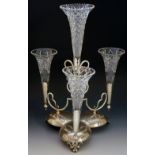 A large silver plated epergne stand with four cut glass flutes with ridged rims,