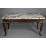 An Irish centre table in Chippendale style the marble top above a shallow frieze gadrooned to the