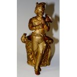 A gilt bronze figure of The Pied Piper standing playing instrument with rats on his leg and on the