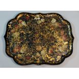 A Victorian shaped rectangular papier maché tray finely painted with floral sprays and gilt detail