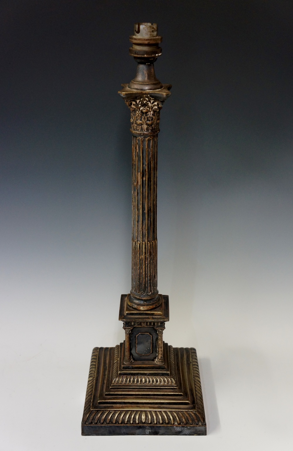 An Edwardian Corinthian column lamp the stop fluted column on pedestal with outset corner columns,