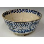 A 19th Century Staffordshire sponge ware bowl the exterior with stylised leaves and lines the