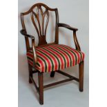 A mahogany Hepplewhite style elbow chair with pierced vasular splat, swept arms,