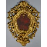 A late 18th Century Italian giltwood frame the central red panel (now lacking crucifix) within