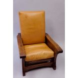 Robert Thompson Of Kilburn - an English oak reclining "smoking"chair with flat tapered arms with