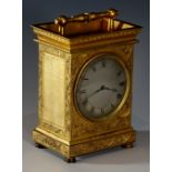 A fine English brass carriage clock the brass case with architectural pediment and post and bale