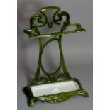 A French green enamelled Art Nouveau umbrella and walking stick stand with white enamelled drip pan,