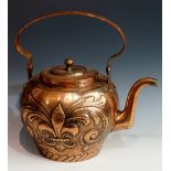 A Dutch copper 9 litre kettle with strap-work handle the body embossed with stylised crest,