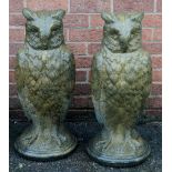 A pair of reconstituted owls, 72cm high,