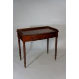 A George IV mahogany bow-front side table, the top with three quarter gallery,