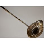 A continental silver ladle with spiral twist baleen handle the fluted bowl with spout,