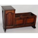 A mid 17th Century Cromwellian oak cradle with raised fielded panels, rectangular canopied hood,