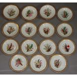 A Worcester dessert service painted with floral sprays within anthemion and jeweled gilt borders,
