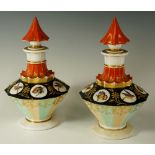 A pair of continental porcelain faceted scent bottles and stoppers the bodies with alternate