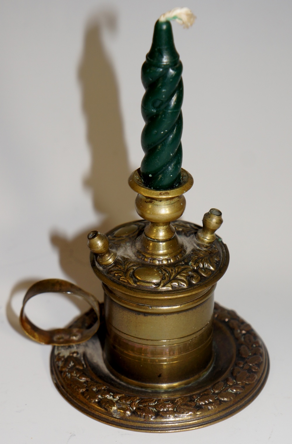 A Victorian small brass desk column candlestick to heat wax for letter seals,