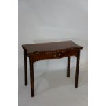 A George III mahogany tea table of serpentine outline the edges egg and dart carved,