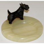 A cold painted metal "Scottie" dog pin tray on circular dished green onyx base, 11.5cm diameter, 6.