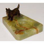 An Austrian bronze "Scottie" dog pin tray on circular dished shaped rectangular base,