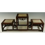 A Chinese hardwood triple stand with raised centre section flanked by conforming lower sections,