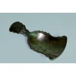 A Chinese caddy spoon of shaped design the handle foliate engraved, marked,
