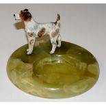 A cold painted Terrier pin tray the dog standing on a circular onyx base, 16cm diameter,