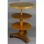 An early Victorian bleached mahogany telescopic circular buffet the well figured tiers above a