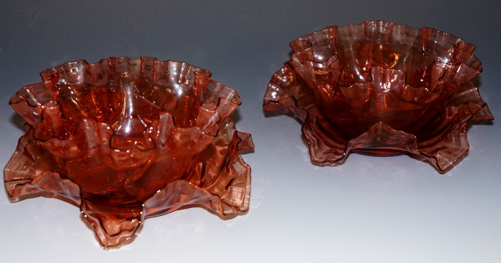 A pair of Victorian garnet red glass bowls and stands, frilled edges, 8cm high,