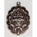 A silver shaped oval medallion cast to the front with symbols and  banner inscribed Equality,