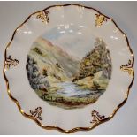 A Royal Crown Derby shaped circular plate painted to the centre with a view of Dovedale,
