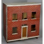 A Georgian style "Red Brick" doll's house the front hinged to the right with three upper windows,