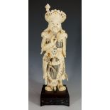 A Chinese carved ivory figure of a warrior, engraved and ink work detailed,