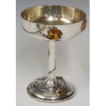 A French enamelled silver goblet the shallow bowl cast with Art Nouveau flower heads and tendrils