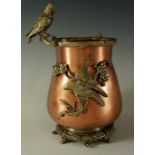 A copper and silvered brass vase the rim with cast cockatoo the bellied copper body with bird
